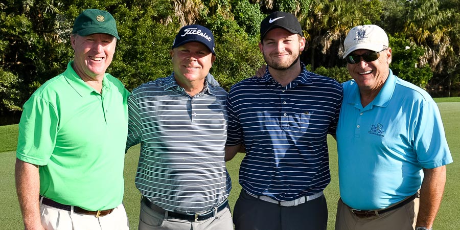 Golfers pose for photo